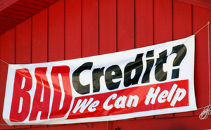 Bad Credit We Can Help Banner on Red Barn House